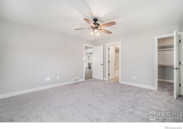 4121 Silene Pl, Loveland, CO 80537 - unfurnished bedroom featuring carpet floors, baseboards, a spacious closet, and visible vents