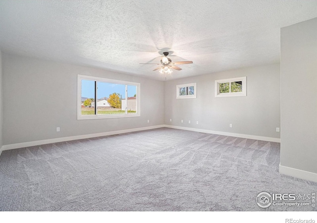 4121 Silene Pl, Loveland, CO 80537 - unfurnished room featuring baseboards, a textured ceiling, carpet, and ceiling fan
