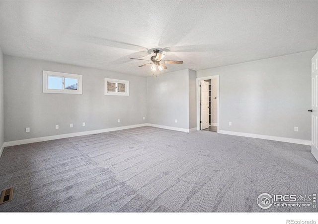 4121 Silene Pl, Loveland, CO 80537 - carpeted empty room featuring baseboards, a ceiling fan, a textured ceiling, and visible vents