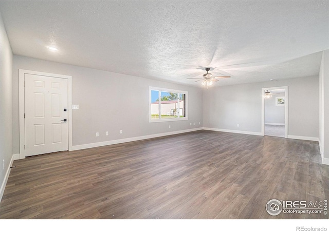 4121 Silene Pl, Loveland, CO 80537 - unfurnished living room featuring a textured ceiling, ceiling fan, dark wood-style floors, and baseboards