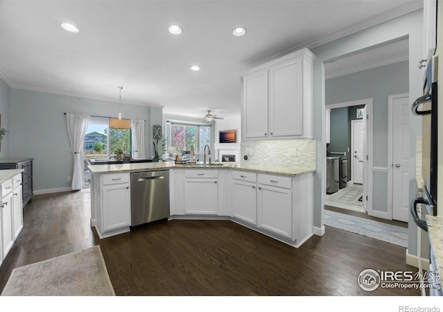 kitchen featuring a peninsula, a sink, white cabinets, crown molding, and dishwasher