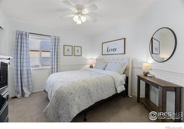 bedroom with baseboards, carpet flooring, and a ceiling fan
