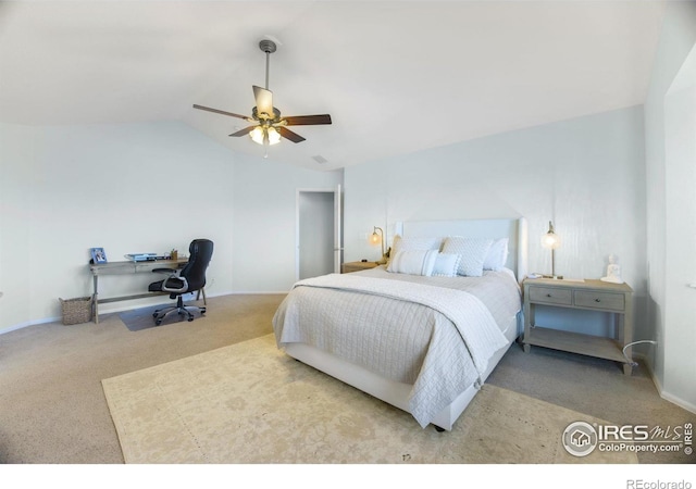 carpeted bedroom with vaulted ceiling and ceiling fan