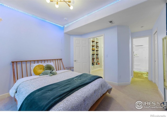 carpeted bedroom featuring visible vents and baseboards
