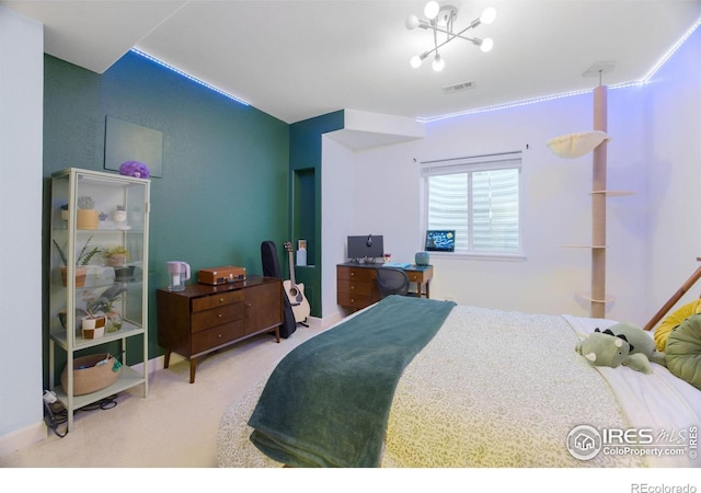 bedroom with a notable chandelier, carpet flooring, and visible vents