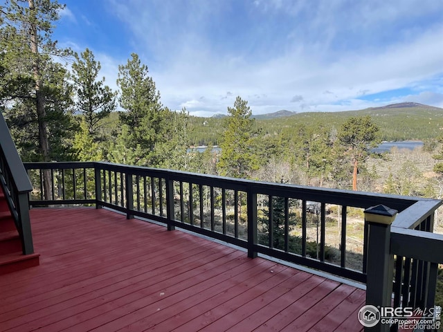 134 Swift Deer Rd, Red Feather Lakes, CO 80545 - wooden deck with a mountain view and a forest view