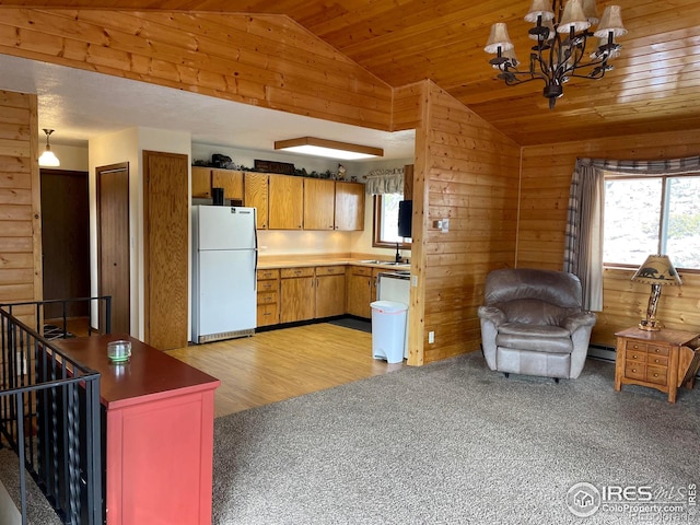 134 Swift Deer Rd, Red Feather Lakes, CO 80545 - kitchen featuring freestanding refrigerator, lofted ceiling, light colored carpet, a chandelier, and wood ceiling