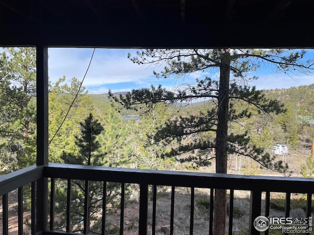 134 Swift Deer Rd, Red Feather Lakes, CO 80545 - balcony featuring a forest view
