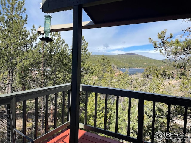 134 Swift Deer Rd, Red Feather Lakes, CO 80545 - wooden terrace with a mountain view