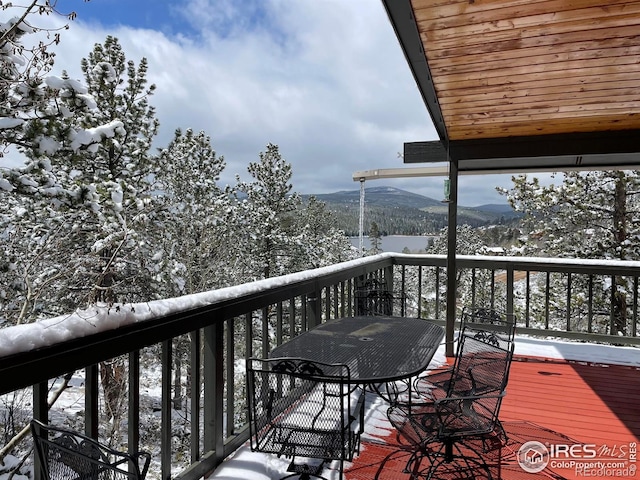 134 Swift Deer Rd, Red Feather Lakes, CO 80545 - snow covered deck featuring a mountain view