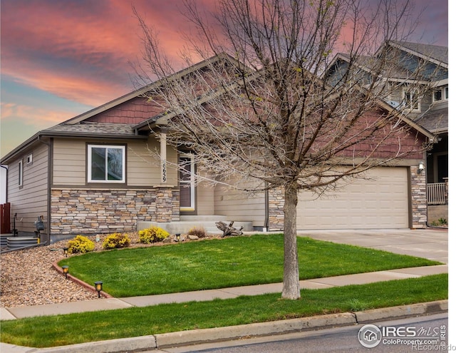 6659 12th St, Frederick, CO 80530 - craftsman inspired home with a front yard, driveway, an attached garage, and stone siding
