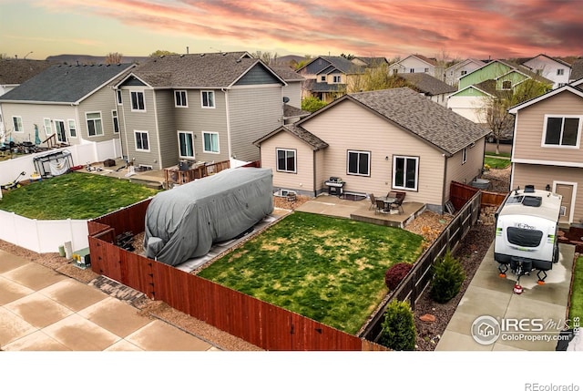 6659 12th St, Frederick, CO 80530 - back of house with ac unit, a residential view, a fenced backyard, and a patio area