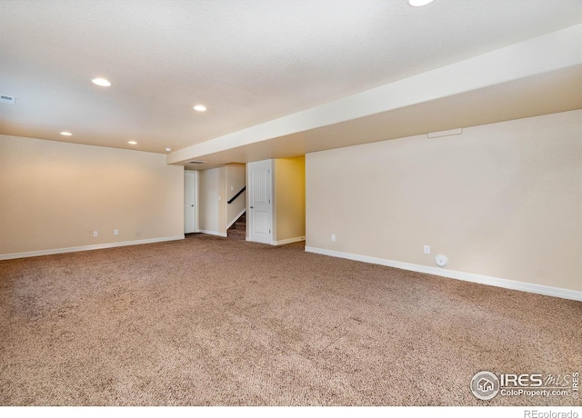 6659 12th St, Frederick, CO 80530 - finished below grade area featuring stairs, recessed lighting, baseboards, and carpet