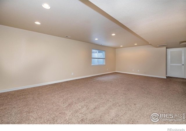 6659 12th St, Frederick, CO 80530 - spare room with carpet floors, baseboards, recessed lighting, and visible vents