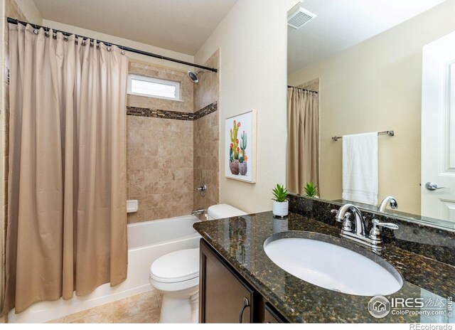 6659 12th St, Frederick, CO 80530 - full bath featuring visible vents, shower / tub combo with curtain, vanity, toilet, and tile patterned floors