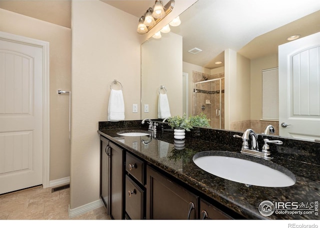 6659 12th St, Frederick, CO 80530 - full bath with a sink, a stall shower, and visible vents
