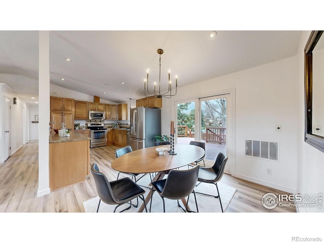 dining area with visible vents, an inviting chandelier, lofted ceiling, recessed lighting, and light wood finished floors