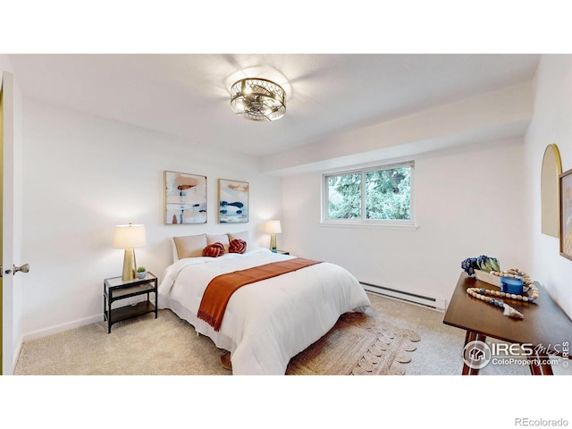 bedroom with baseboards, a baseboard radiator, and light colored carpet