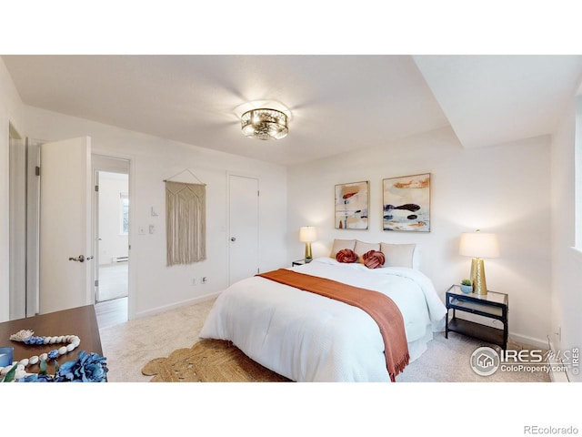 bedroom with baseboards and carpet flooring