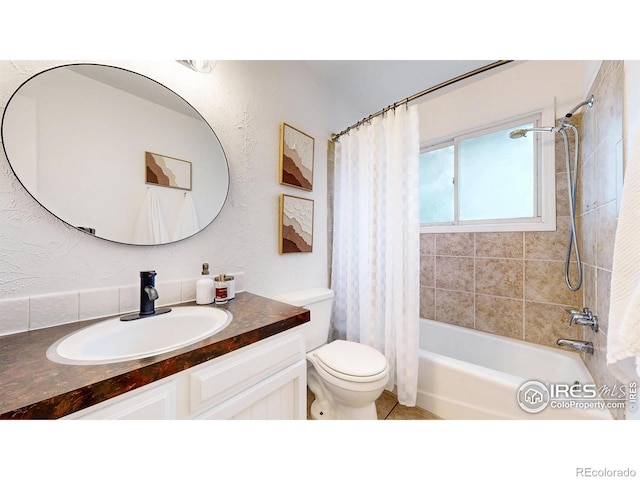 full bathroom with toilet, shower / bath combination with curtain, and vanity