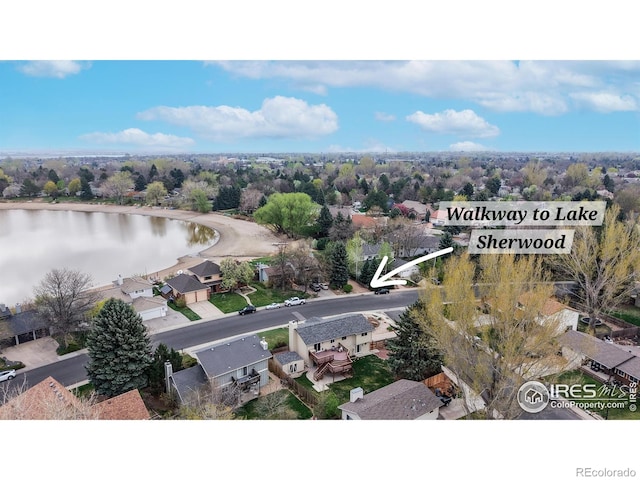 bird's eye view featuring a residential view and a water view