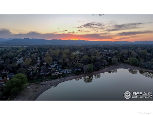 bird's eye view with a water and mountain view
