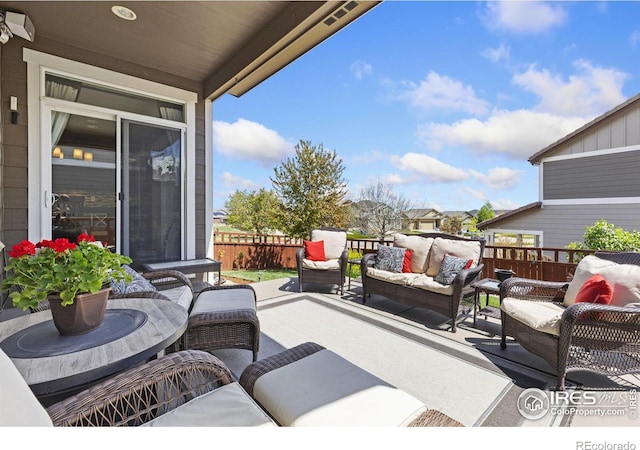 view of patio / terrace featuring fence and outdoor lounge area