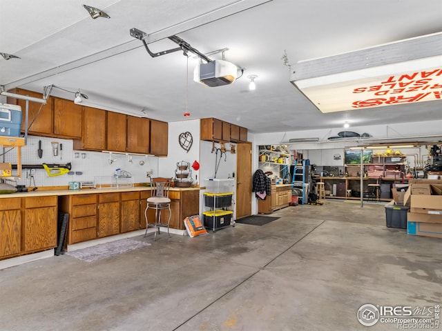 2505 Longview Dr, Estes Park, CO 80517 - garage featuring a workshop area and a garage door opener