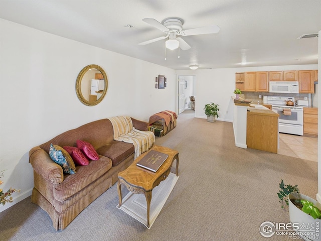 5425 County Road 32 Unit 15, Mead, CO 80504 - living room featuring ceiling fan, light colored carpet, and baseboards