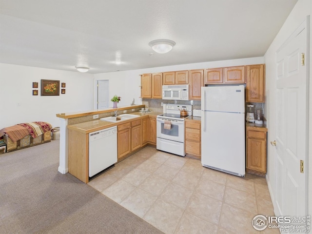 5425 County Road 32 Unit 15, Mead, CO 80504 - kitchen with white appliances, a sink, a peninsula, open floor plan, and light countertops