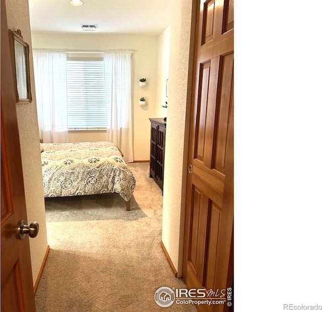 13873 Legend Way Unit 103, Broomfield, CO 80023 - bedroom featuring light carpet and recessed lighting
