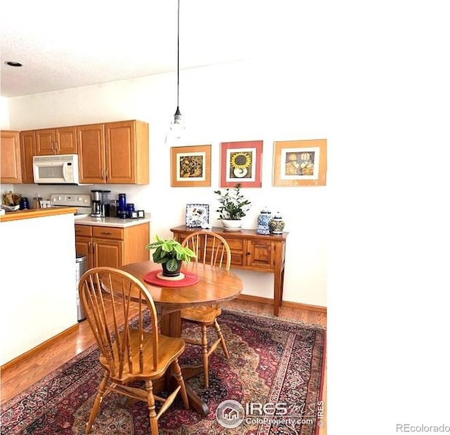 13873 Legend Way Unit 103, Broomfield, CO 80023 - dining space featuring wood finished floors