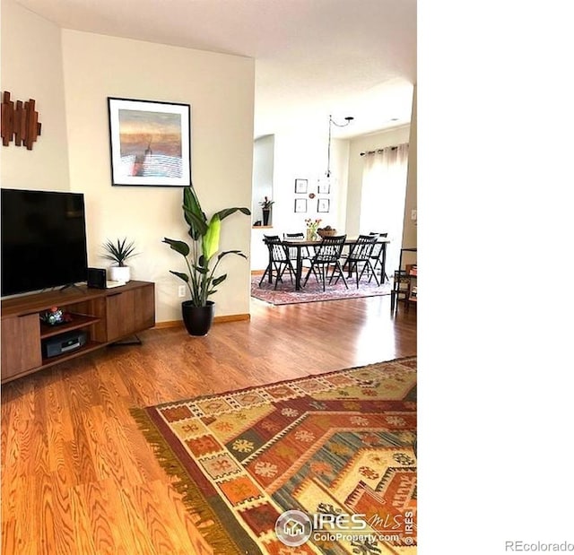 13873 Legend Way Unit 103, Broomfield, CO 80023 - living area with wood finished floors