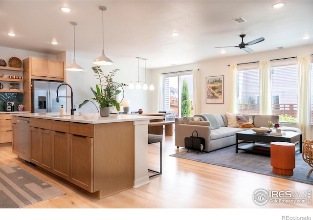 4424 Haymill Ct, Timnath, CO 80547 - kitchen featuring a sink, light wood-style flooring, appliances with stainless steel finishes, open shelves, and ceiling fan