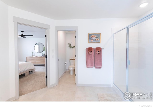 4424 Haymill Ct, Timnath, CO 80547 - full bathroom with a shower stall, toilet, a ceiling fan, and baseboards