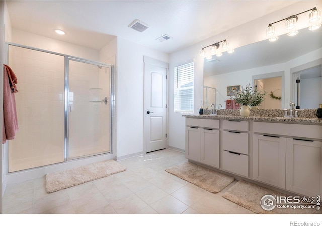 4424 Haymill Ct, Timnath, CO 80547 - full bath featuring a shower stall, double vanity, tile patterned floors, and baseboards