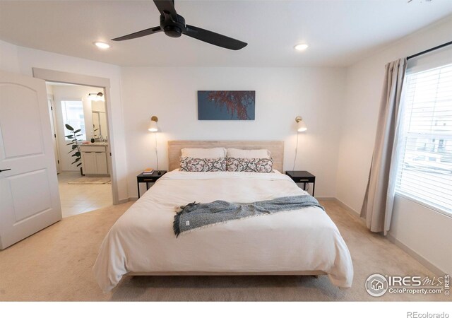 4424 Haymill Ct, Timnath, CO 80547 - bedroom featuring light colored carpet, multiple windows, ensuite bathroom, recessed lighting, and baseboards
