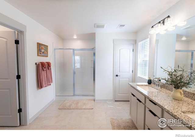 4424 Haymill Ct, Timnath, CO 80547 - full bath featuring a shower stall, baseboards, tile patterned floors, and double vanity