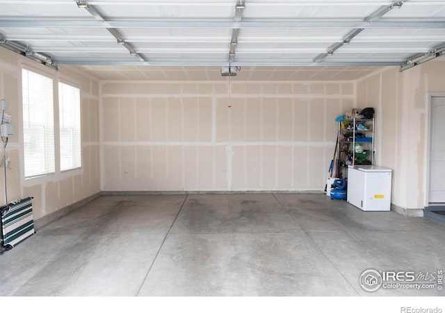 4424 Haymill Ct, Timnath, CO 80547 - garage with fridge and a garage door opener