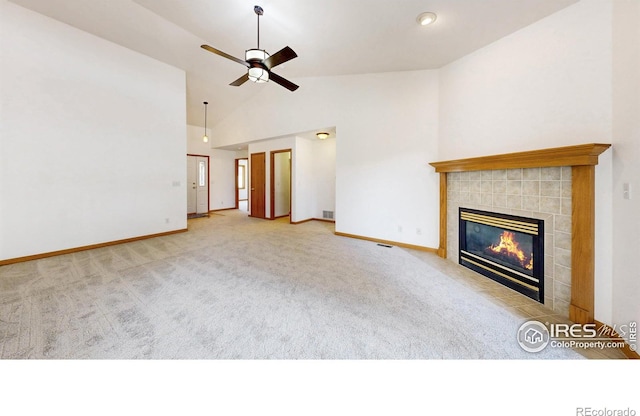 711 Eagle Ln, Estes Park, CO 80517 - unfurnished living room featuring baseboards, carpet flooring, a ceiling fan, and a tile fireplace