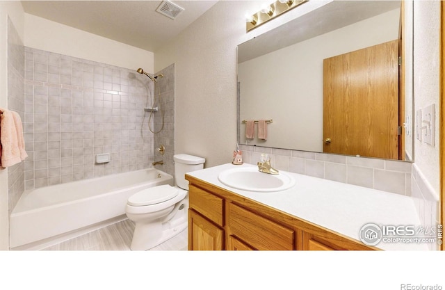 711 Eagle Ln, Estes Park, CO 80517 - bathroom featuring vanity, shower / bathtub combination, toilet, and visible vents