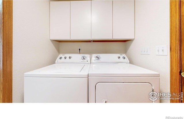 711 Eagle Ln, Estes Park, CO 80517 - laundry area featuring cabinet space and separate washer and dryer