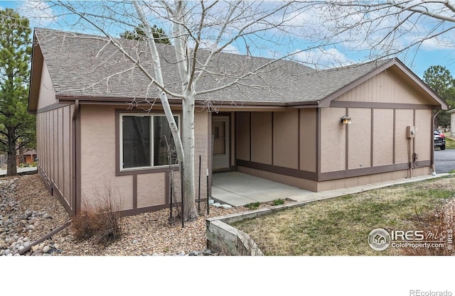 711 Eagle Ln, Estes Park, CO 80517 - back of house featuring board and batten siding, a patio, a shingled roof, and stucco siding