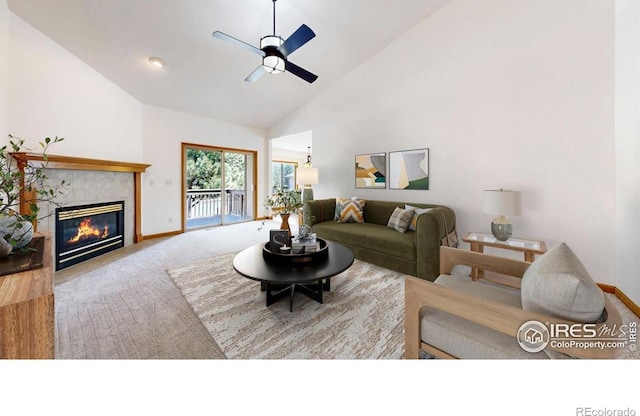 711 Eagle Ln, Estes Park, CO 80517 - carpeted living area featuring baseboards, ceiling fan, a tiled fireplace, and high vaulted ceiling