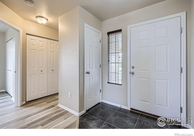 8301 W 18th Street Rd, Greeley, CO 80634 - entrance foyer with baseboards and tile patterned flooring