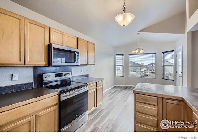 8301 W 18th Street Rd, Greeley, CO 80634 - kitchen featuring appliances with stainless steel finishes, light wood-style floors, vaulted ceiling, decorative light fixtures, and light brown cabinetry