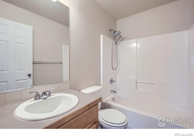 8301 W 18th Street Rd, Greeley, CO 80634 - full bathroom featuring toilet, vanity, and bathing tub / shower combination