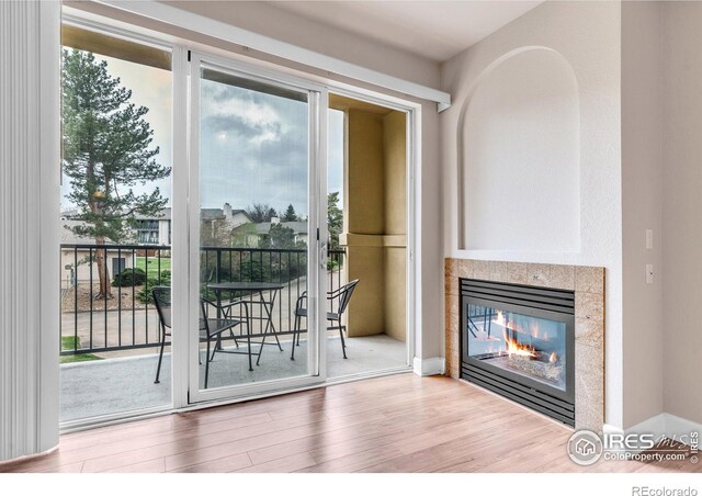 4500 Baseline Rd Unit 3203, Boulder, CO 80303 - doorway to outside with a fireplace and wood finished floors