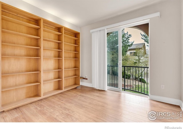 4500 Baseline Rd Unit 3203, Boulder, CO 80303 - unfurnished room featuring built in features, wood finished floors, and baseboards