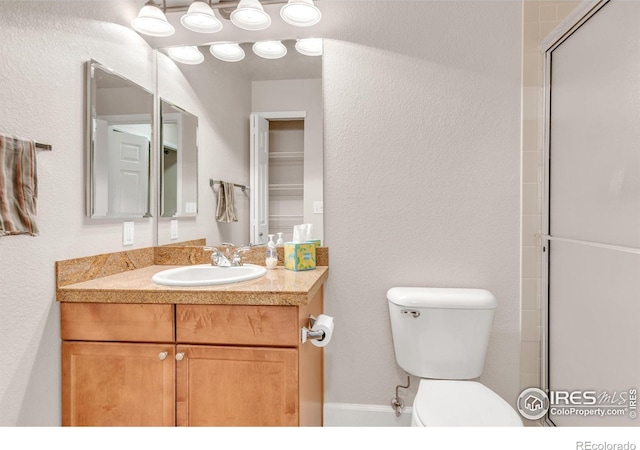 4500 Baseline Rd Unit 3203, Boulder, CO 80303 - bathroom featuring toilet, vanity, and a textured wall